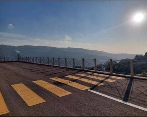 Finished road and crossing with mountain views at the Ajaltoun villas